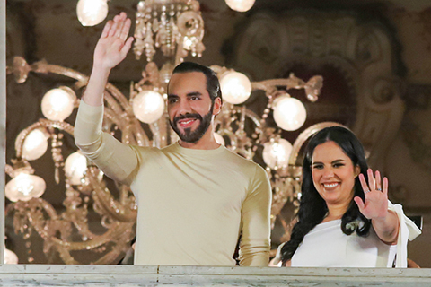 El Salvador President Nayib Bukele, left, and his wife, Gabriela Rodriguez, wave to supporters from the balcony of the presidential palace in San Salvador, El Salvador, after polls closed for general elections on Feb. 4. Photo: The Associated Press