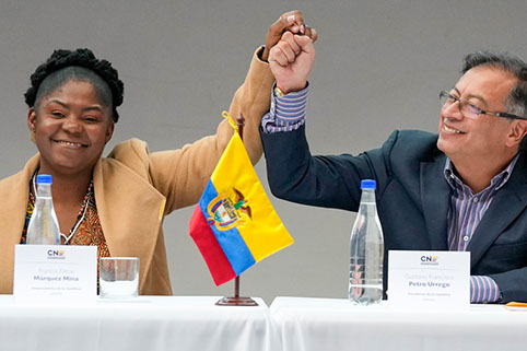 Colombian President-elect Gustavo Petro, right, and running mate Francia Márquez, join hands during a ceremony that certifies their election victory, in Bogota, Colombia, Thursday, June 23.