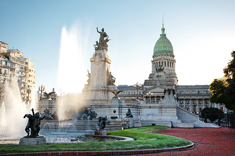 image of buenos aires, a capitol building over a fountain surrounded by statues.
