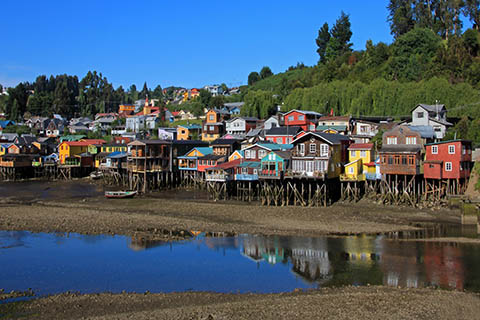 A photo of palafito houses in Chiloe Island, Chile.