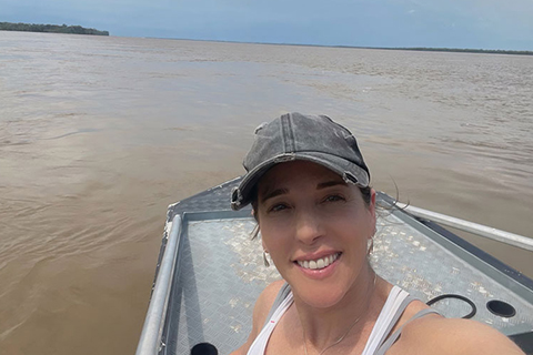 Tracy Devine Guzmán traveling on a boat in Amazonas, Brazil.